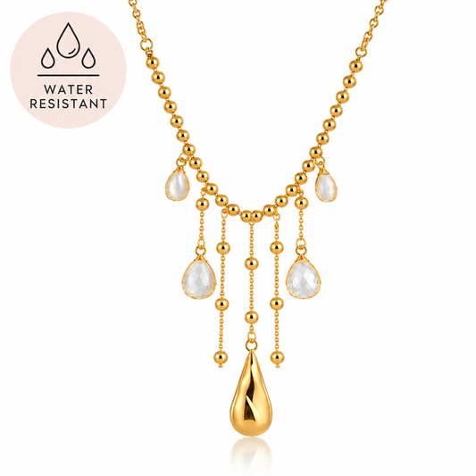 Dewdrop Clear Zircon Gold Tassel Necklace by Aster & Aura with beaded chain and gold teardrop pendant