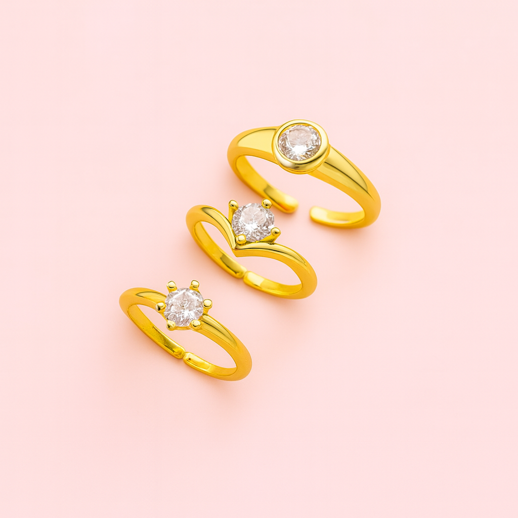 Dainty gold adjustable rings from Aster & Aura styled together as a ring stack